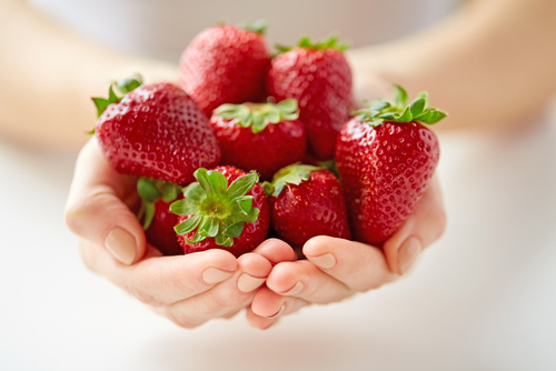 Strawberries in hands image